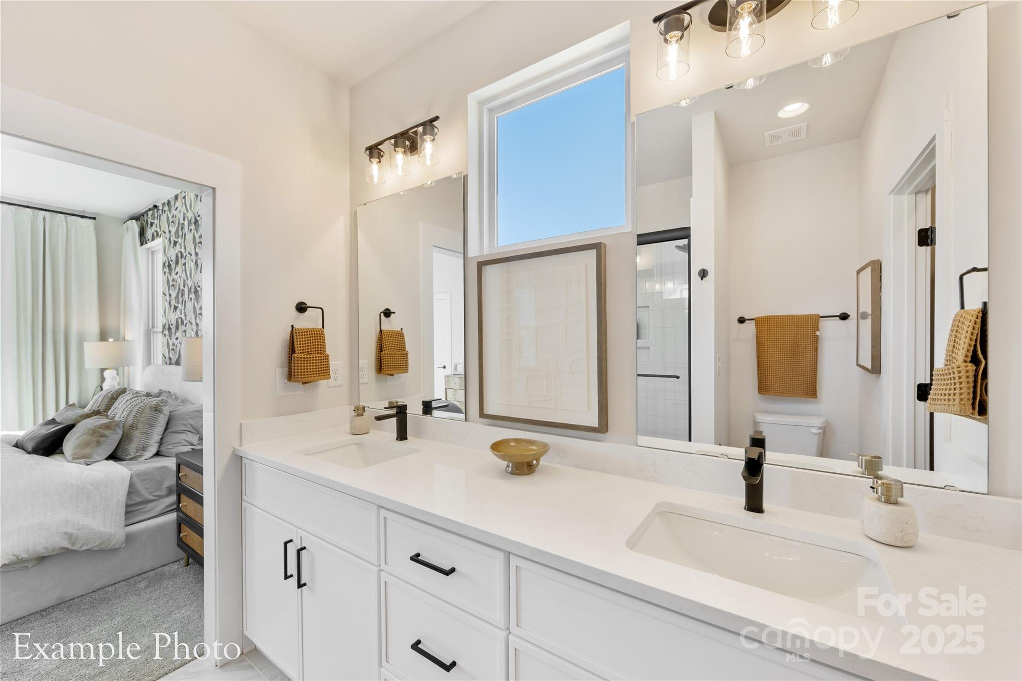 548 Rountree Road, Unit 9 Charlotte, NC 28217 - Photo 23 of 36 a bathroom with a double vanity sink mirror and double