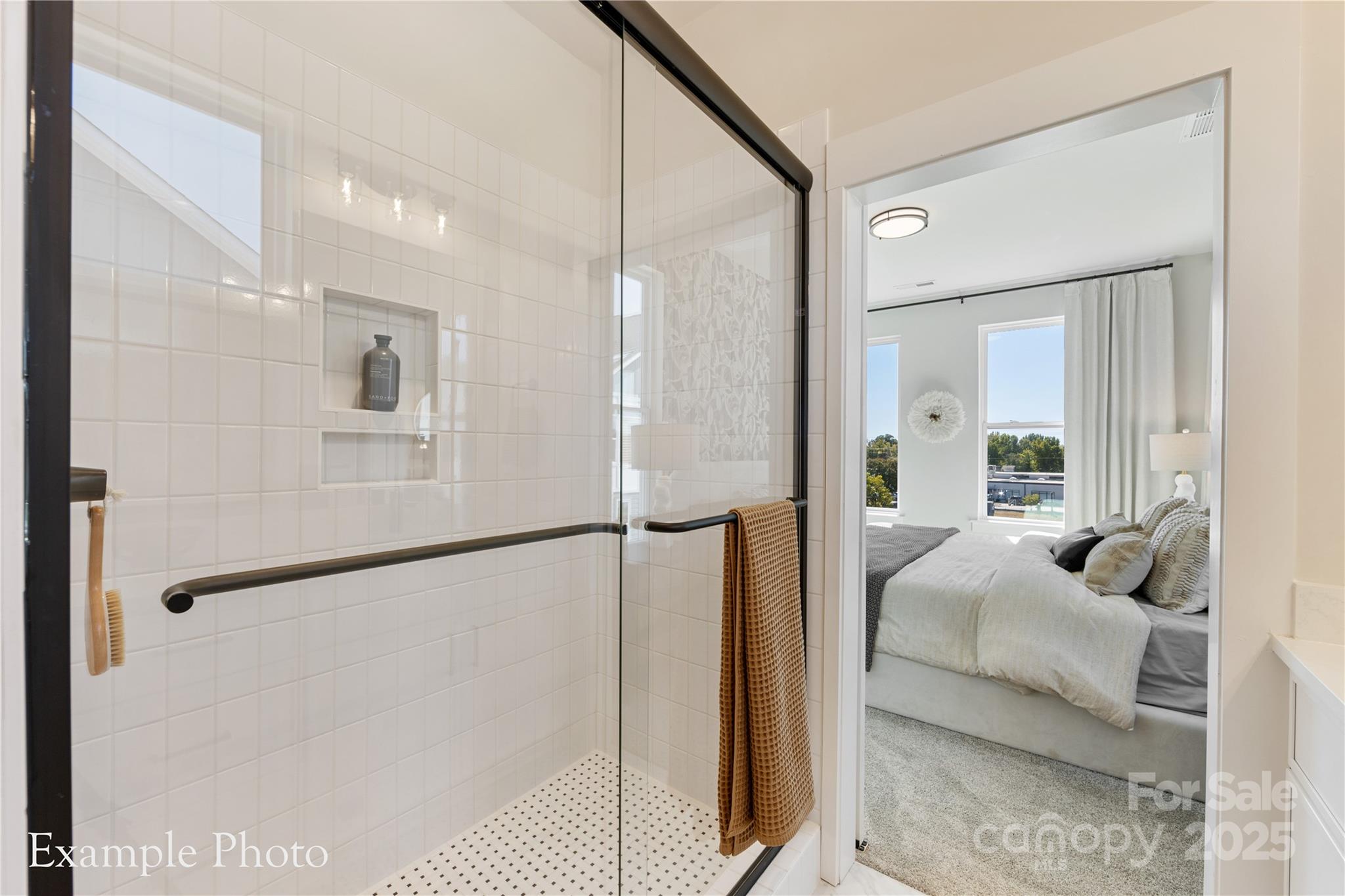 548 Rountree Road, Unit 9 Charlotte, NC 28217 - Photo 24 of 36 a en suite bathroom with a tub shower and bedroom view