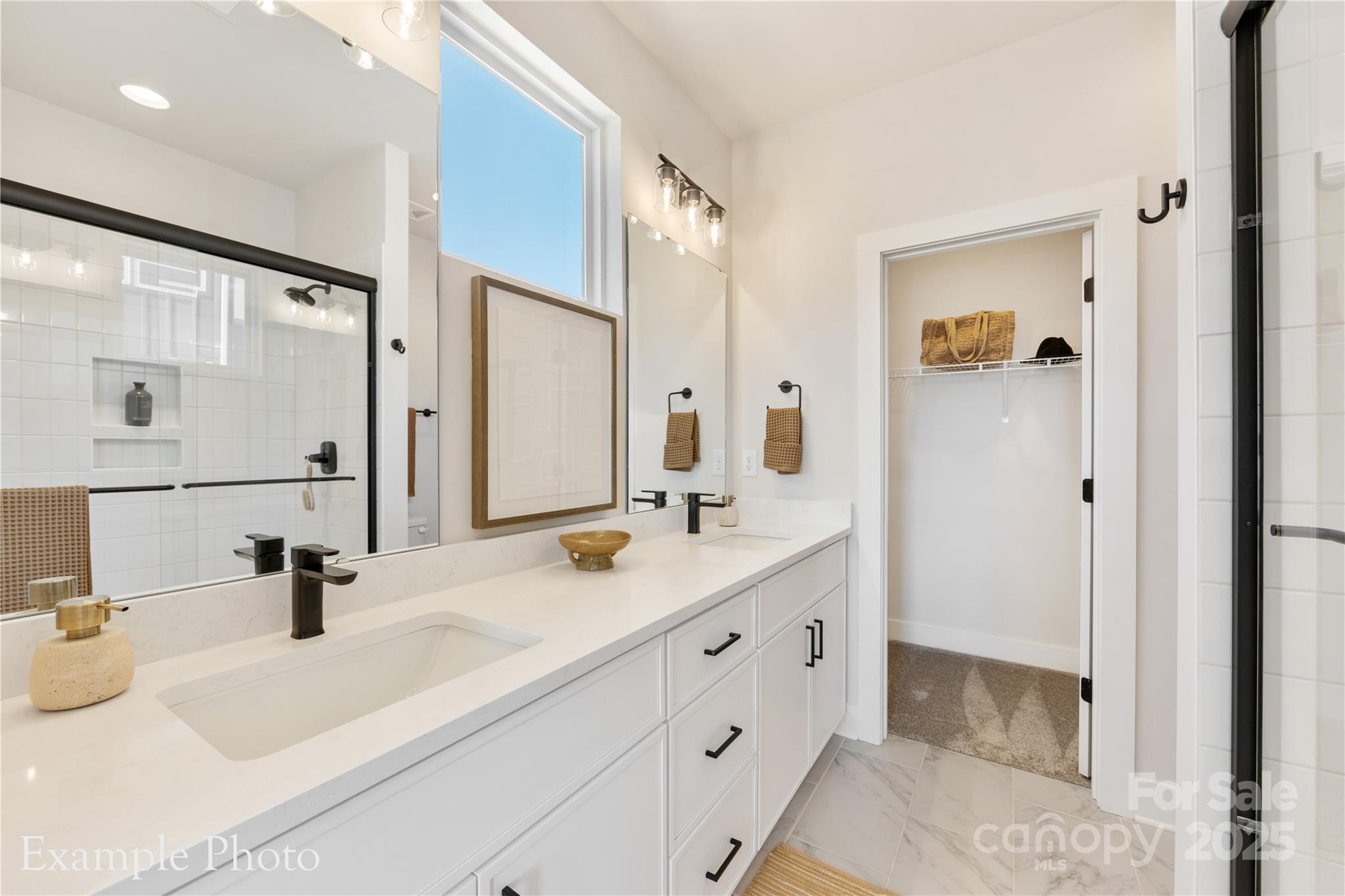 548 Rountree Road, Unit 9 Charlotte, NC 28217 - Photo 25 of 36 a bathroom with a double vanity sink mirror and shower