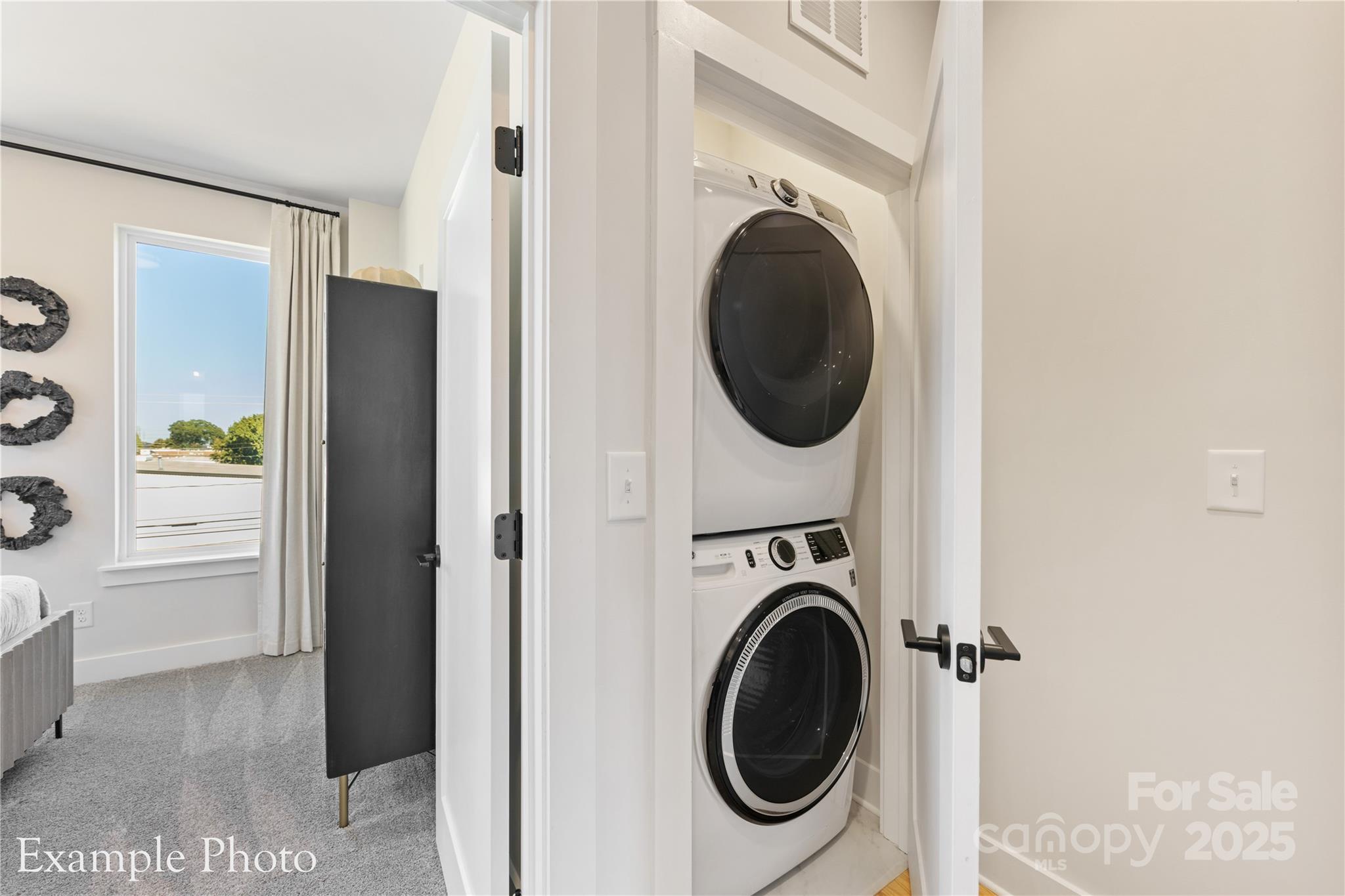 548 Rountree Road, Unit 9 Charlotte, NC 28217 - Photo 26 of 36 a view of a hallway with washer and dryer