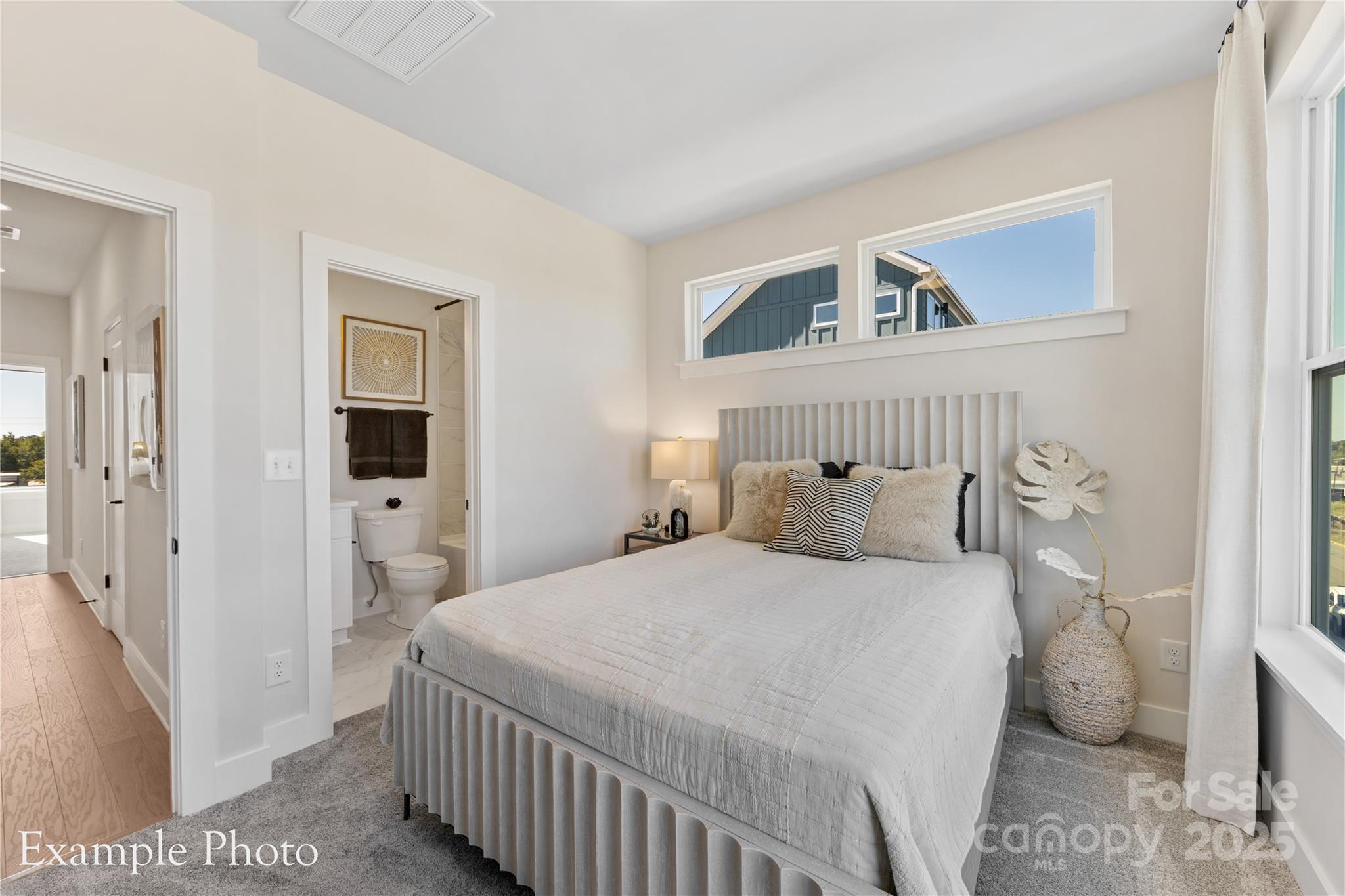 548 Rountree Road, Unit 9 Charlotte, NC 28217 - Photo 27 of 36 a bedroom with a bed and a window