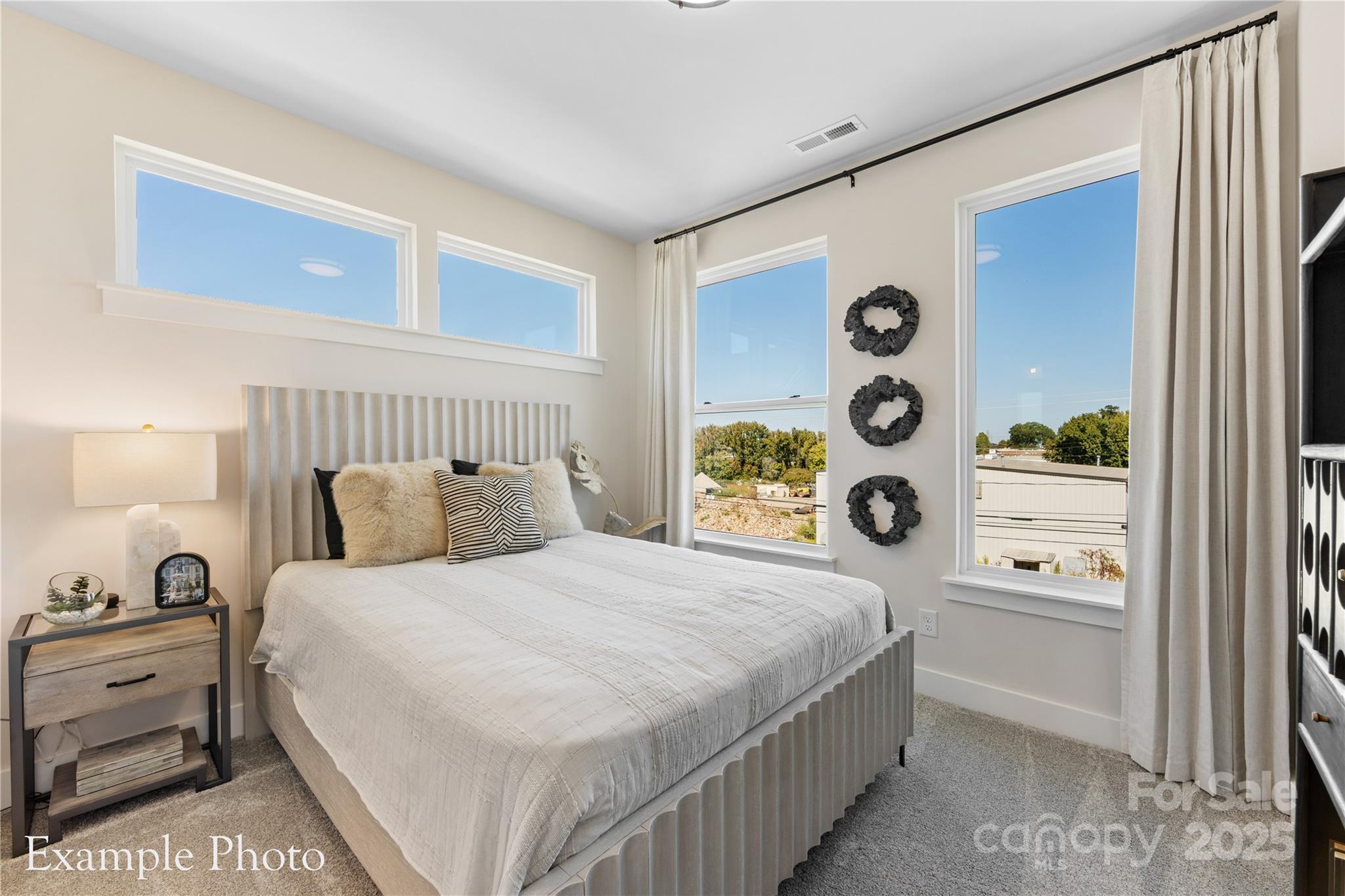 548 Rountree Road, Unit 9 Charlotte, NC 28217 - Photo 28 of 36 a bedroom with a bed and a window