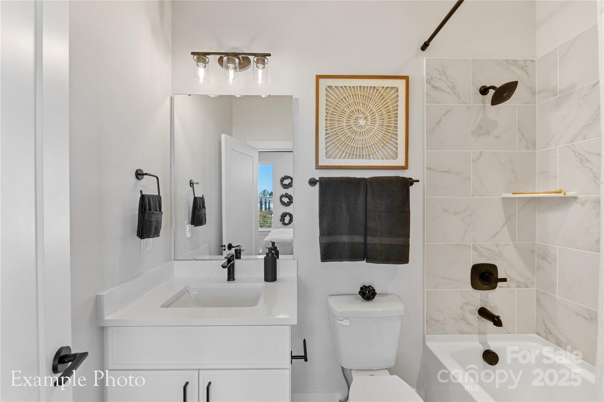 548 Rountree Road, Unit 9 Charlotte, NC 28217 - Photo 30 of 36 a bathroom with a sink toilet and shower