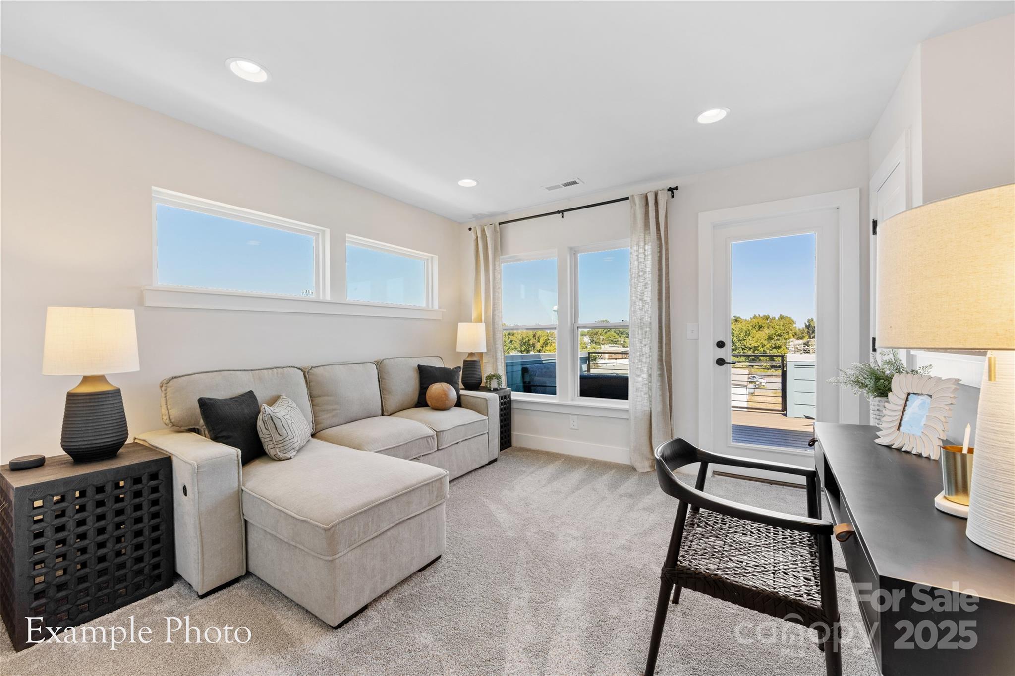 548 Rountree Road, Unit 9 Charlotte, NC 28217 - Photo 31 of 36 a living room with furniture a table and a potted plant