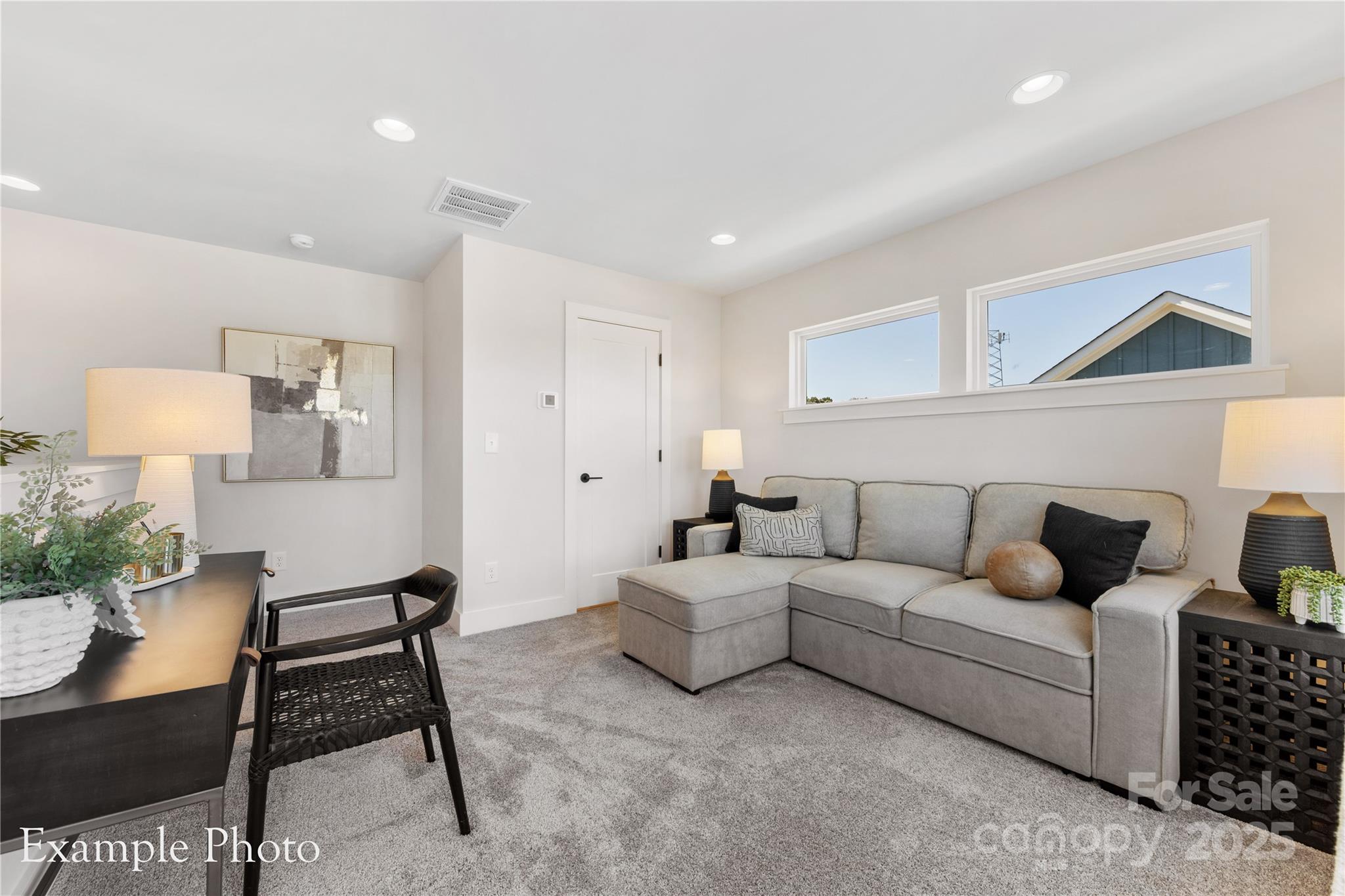 548 Rountree Road, Unit 9 Charlotte, NC 28217 - Photo 32 of 36 a living room with furniture and a lamp