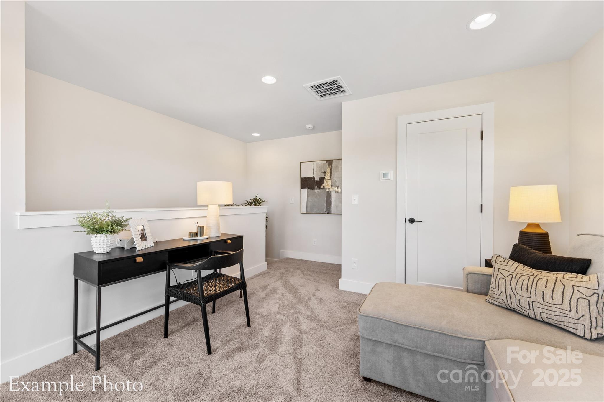 548 Rountree Road, Unit 9 Charlotte, NC 28217 - Photo 33 of 36 a bedroom with a bed and a lamp