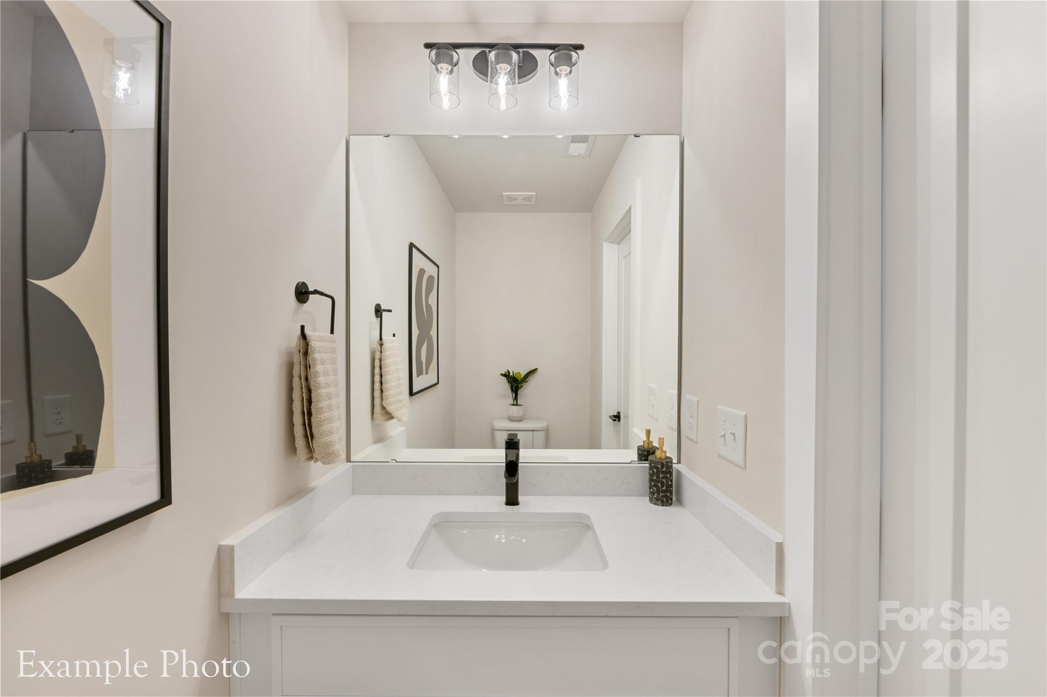548 Rountree Road, Unit 9 Charlotte, NC 28217 - Photo 34 of 36 a bathroom with a sink and a mirror