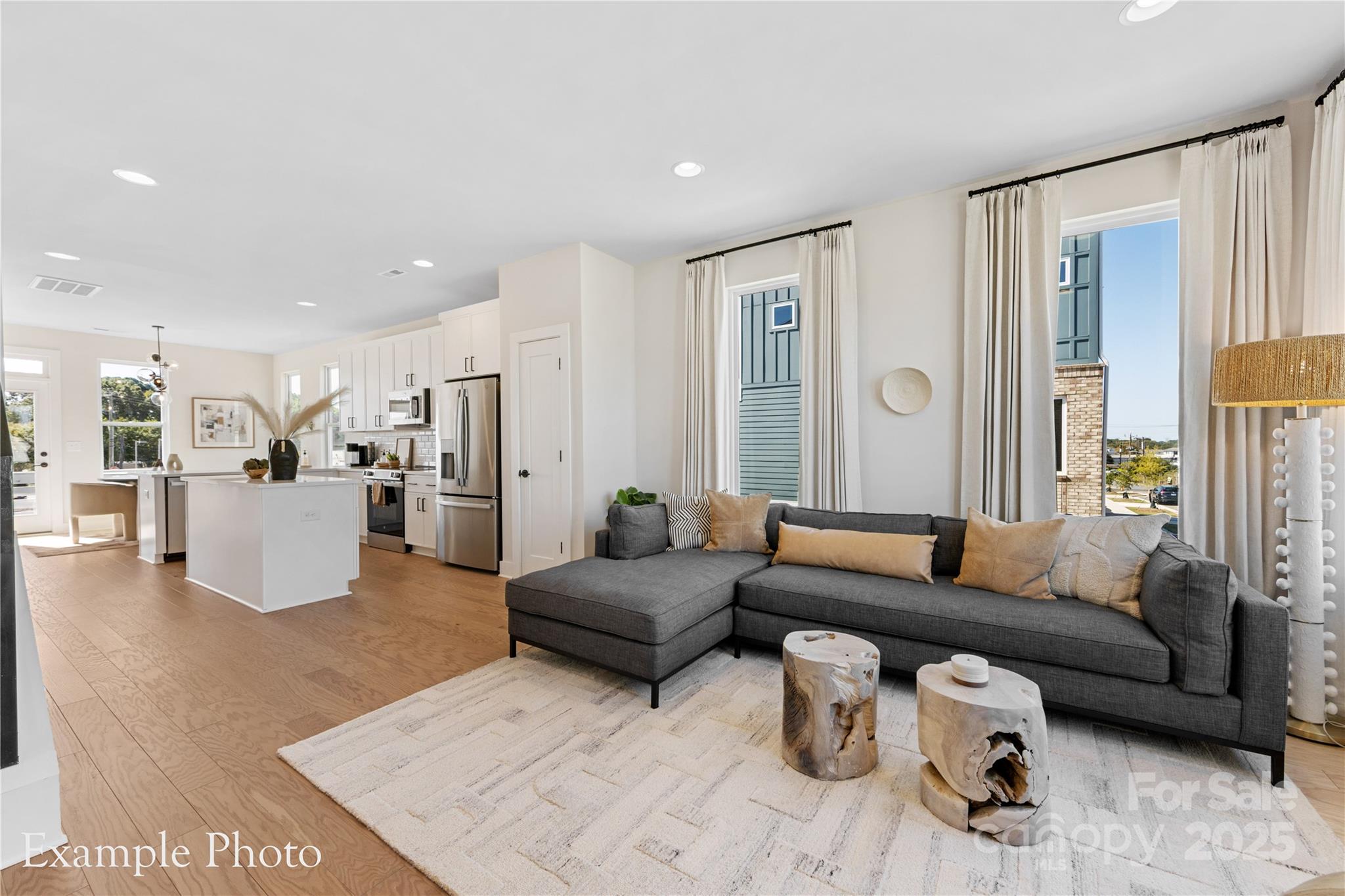 548 Rountree Road, Unit 9 Charlotte, NC 28217 - Photo 7 of 36 a living room with furniture and view of kitchen