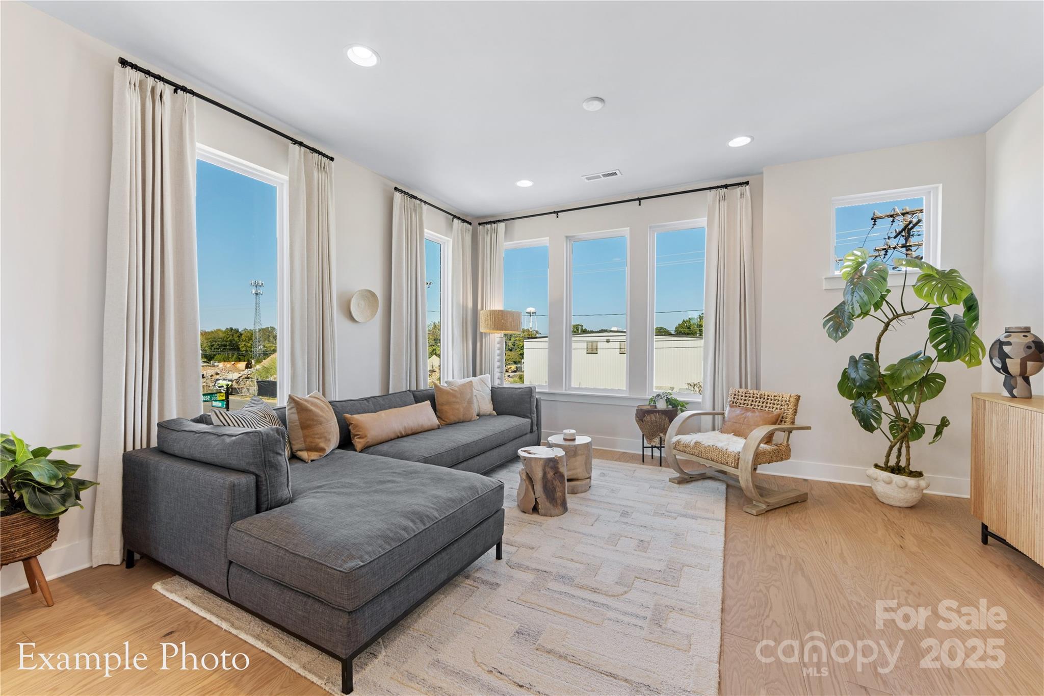 548 Rountree Road, Unit 9 Charlotte, NC 28217 - Photo 8 of 36 a living room with furniture potted plant and a window