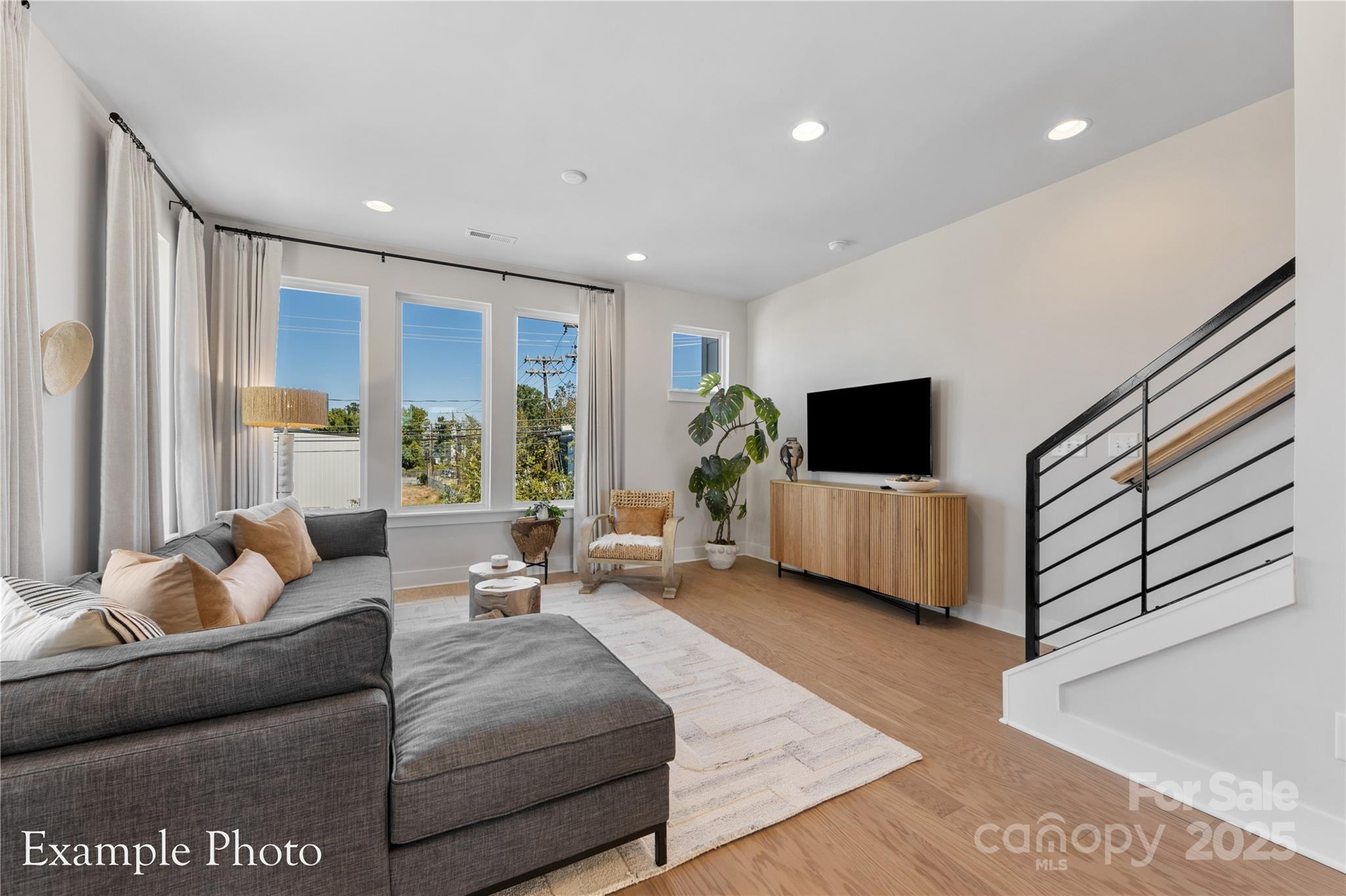 548 Rountree Road, Unit 9 Charlotte, NC 28217 - Photo 9 of 36 a living room with furniture and a flat screen tv