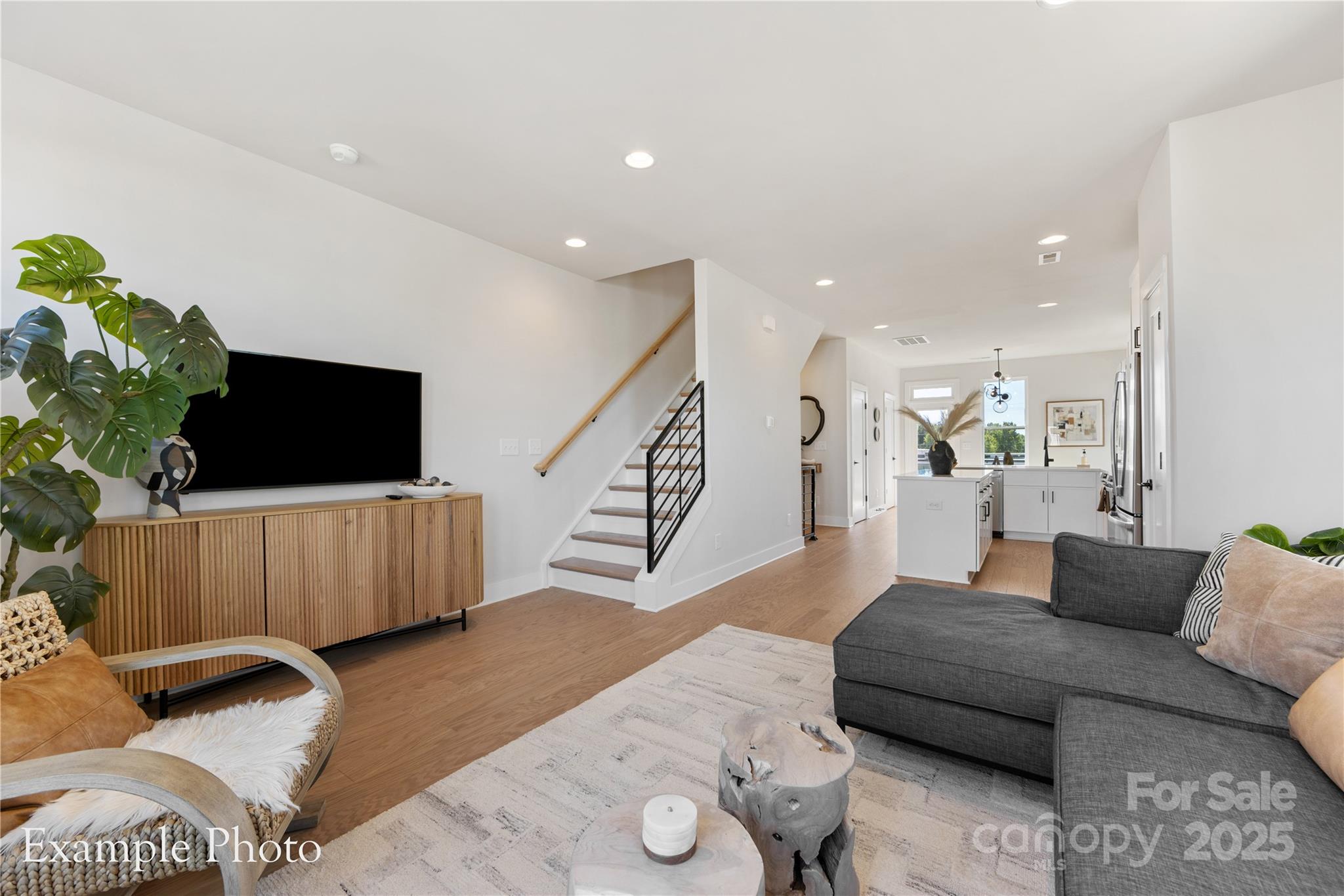 548 Rountree Road, Unit 9 Charlotte, NC 28217 - Photo 10 of 36 a living room with furniture and a flat screen tv