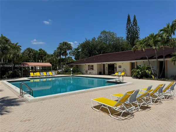 a view of a swimming pool with a lounge chair