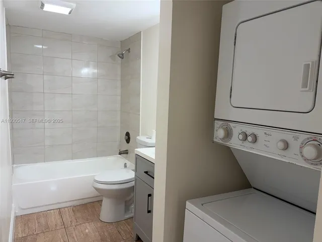 a bathroom with a toilet and a bathtub