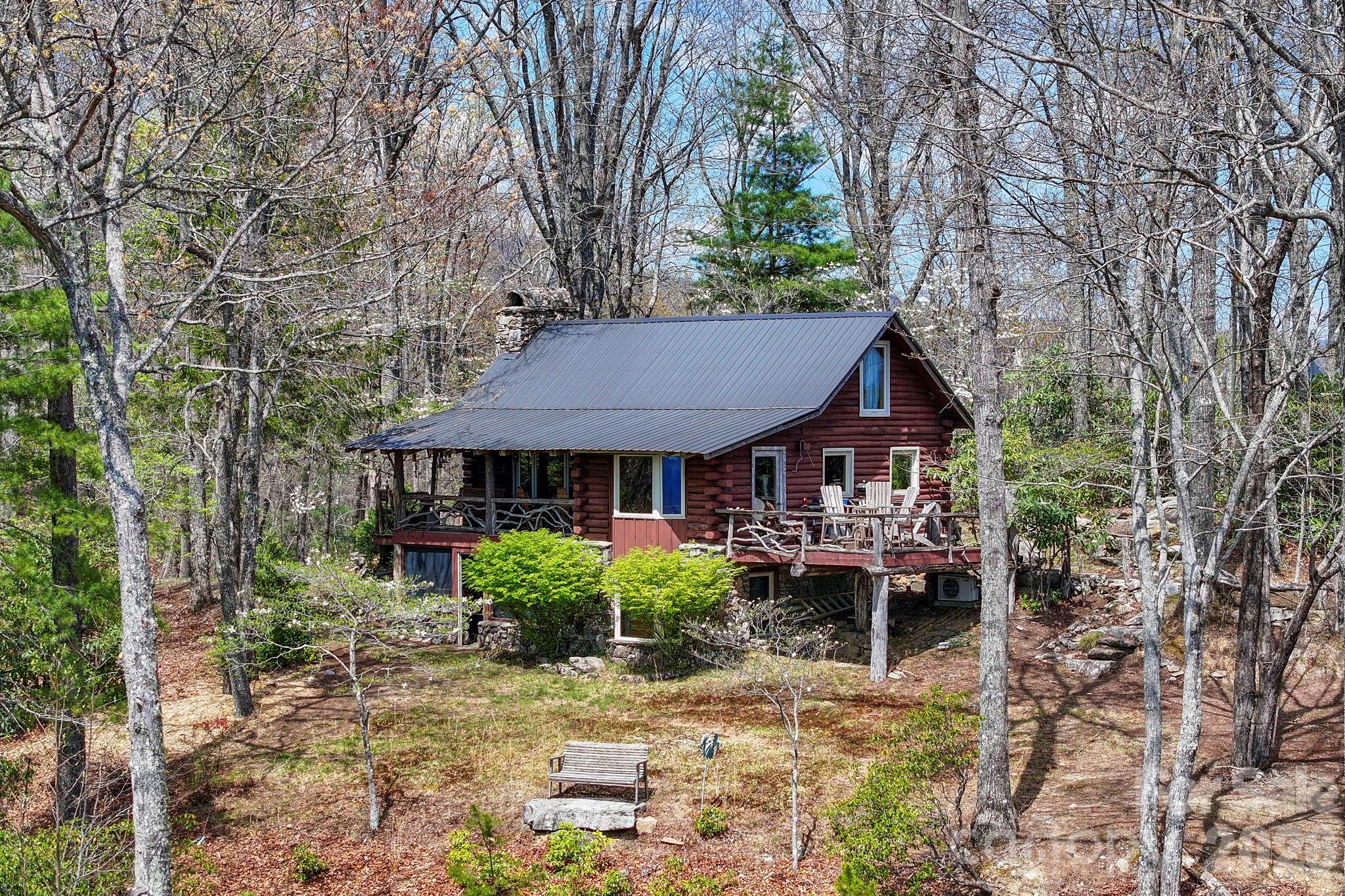 305 Stamey Creek Road Brevard, NC 28712 - Photo 1 of 32 a view of a house with backyard and sitting area