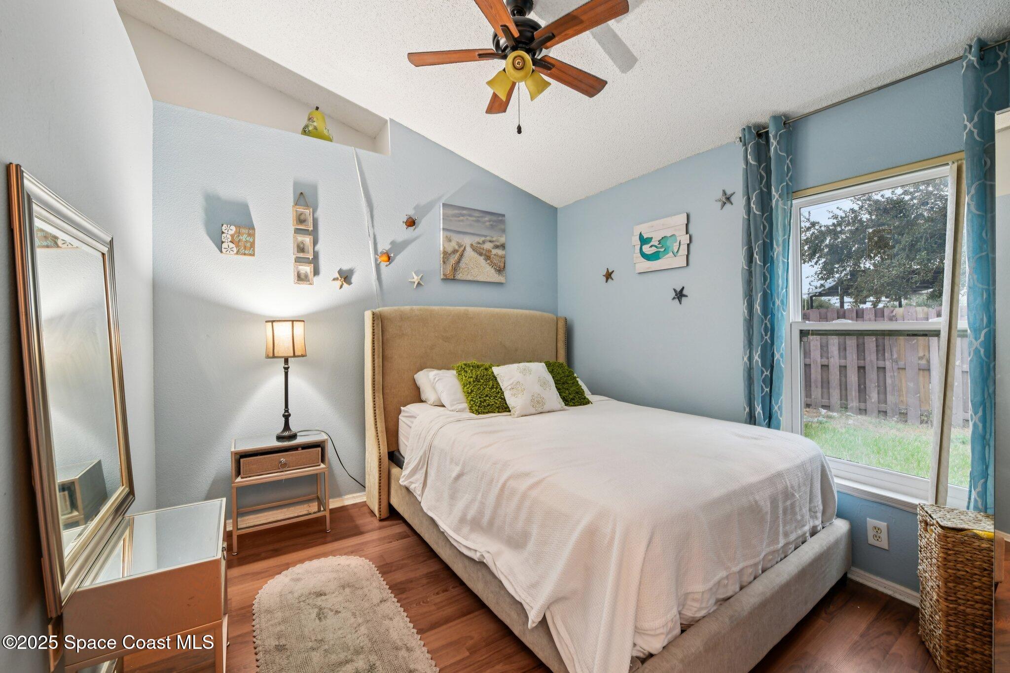 1125 Carey Glen Circle Orlando, FL 32824 - Photo 17 of 31 a bedroom with a bed and a window