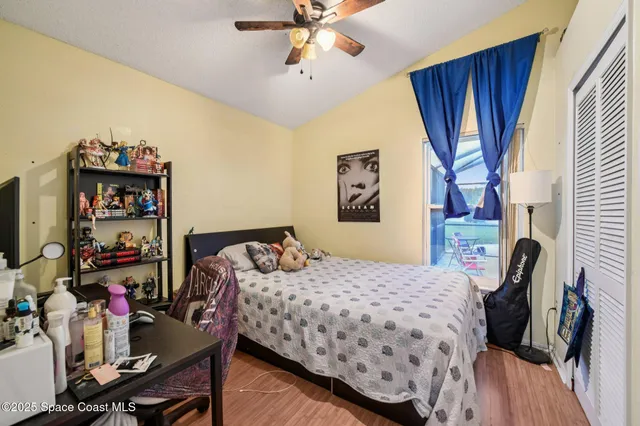 a bedroom that has a bed and a table in it