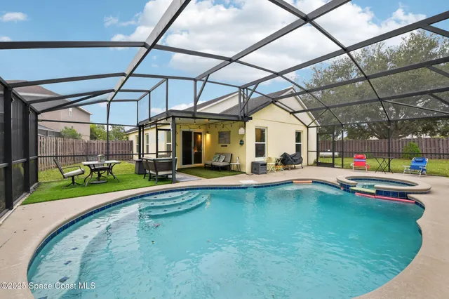 a view of a swimming pool with a patio