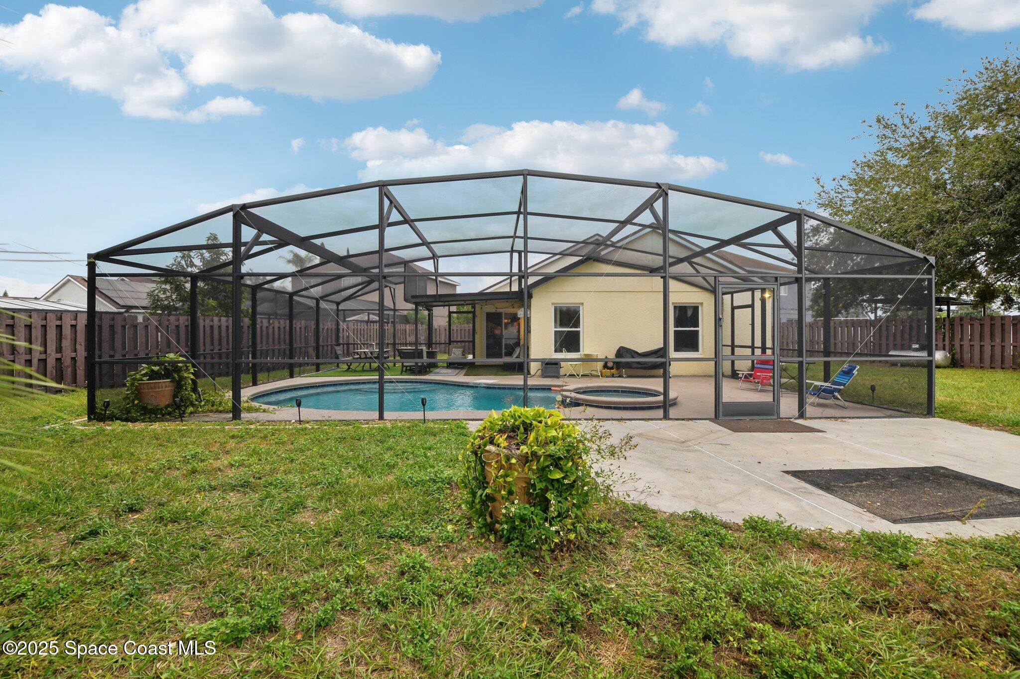 1125 Carey Glen Circle Orlando, FL 32824 - Photo 26 of 31 a view of a house with backyard and porch