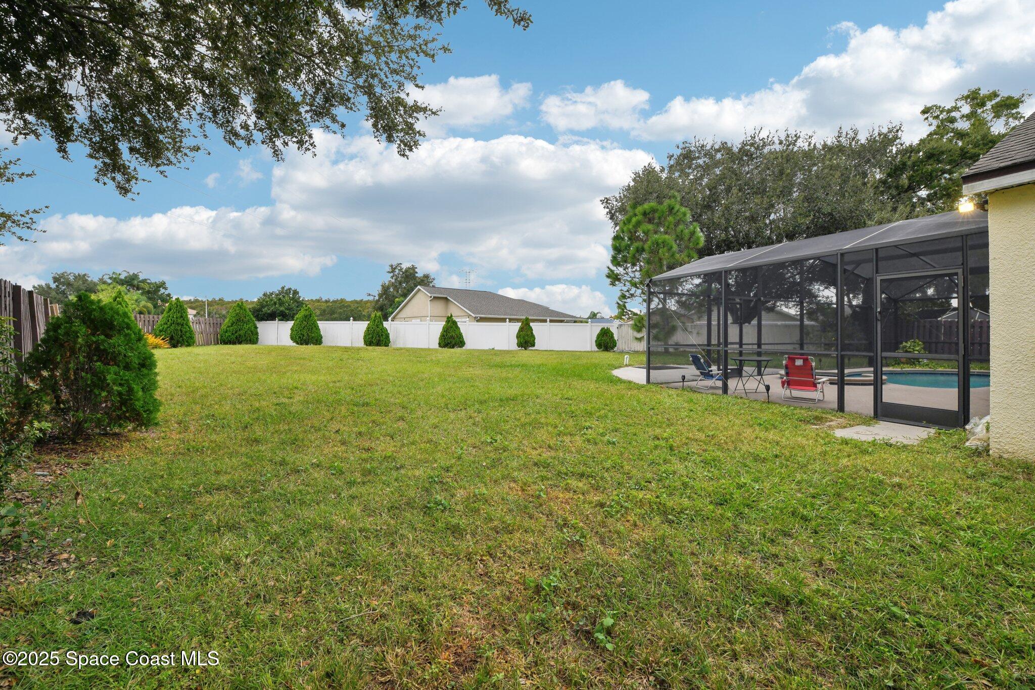 1125 Carey Glen Circle Orlando, FL 32824 - Photo 28 of 31 a view of a garden