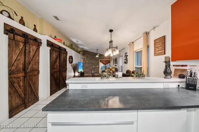 a view of a living room and entry way