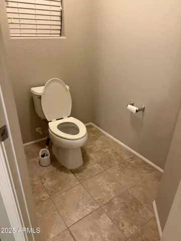 a bathroom with a toilet and a vanity