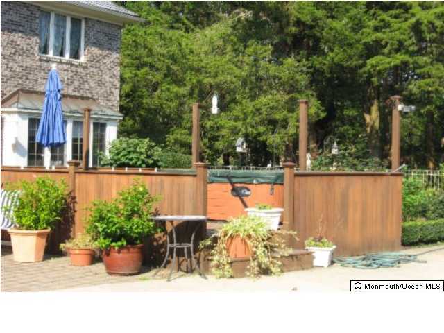 2616 River Road Manasquan, NJ 08736 - Photo 6 of 9 a view of a backyard with sitting area
