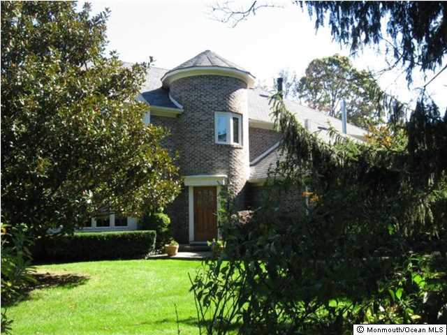 2616 River Road Manasquan, NJ 08736 - Photo 8 of 9 a view of a house with a yard and plants