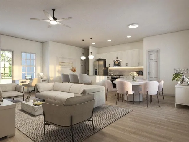 a large room with lots of white furniture