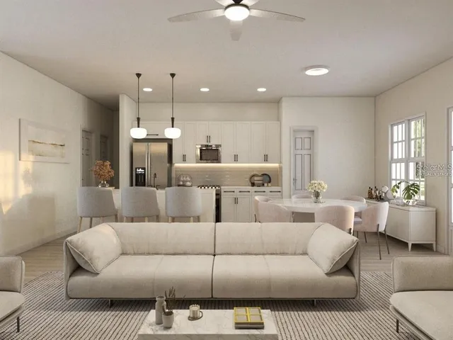 a view of a living room kitchen and a wooden floor