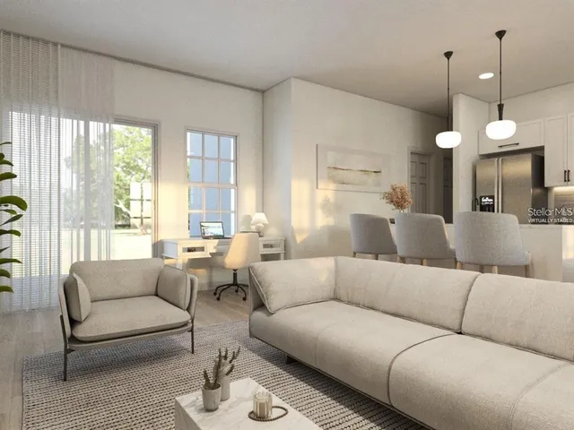 a living room with furniture and a large window