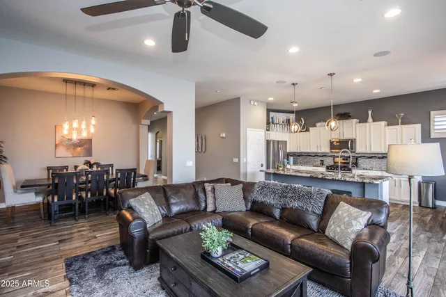 a view of a living room kitchen and a wooden floor