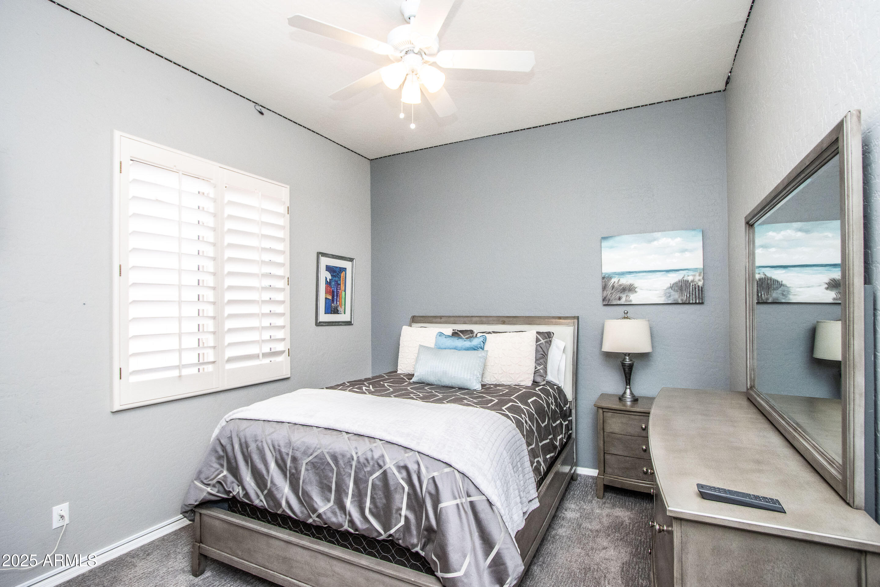 10412 East Acoma Drive Scottsdale, AZ 85255 - Photo 18 of 21 a bedroom with a bed and window