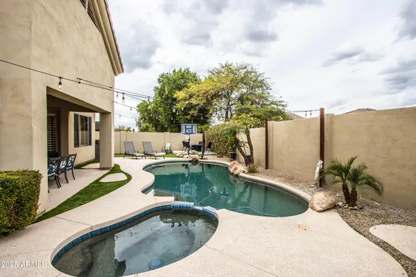 a view of a swimming pool with a patio