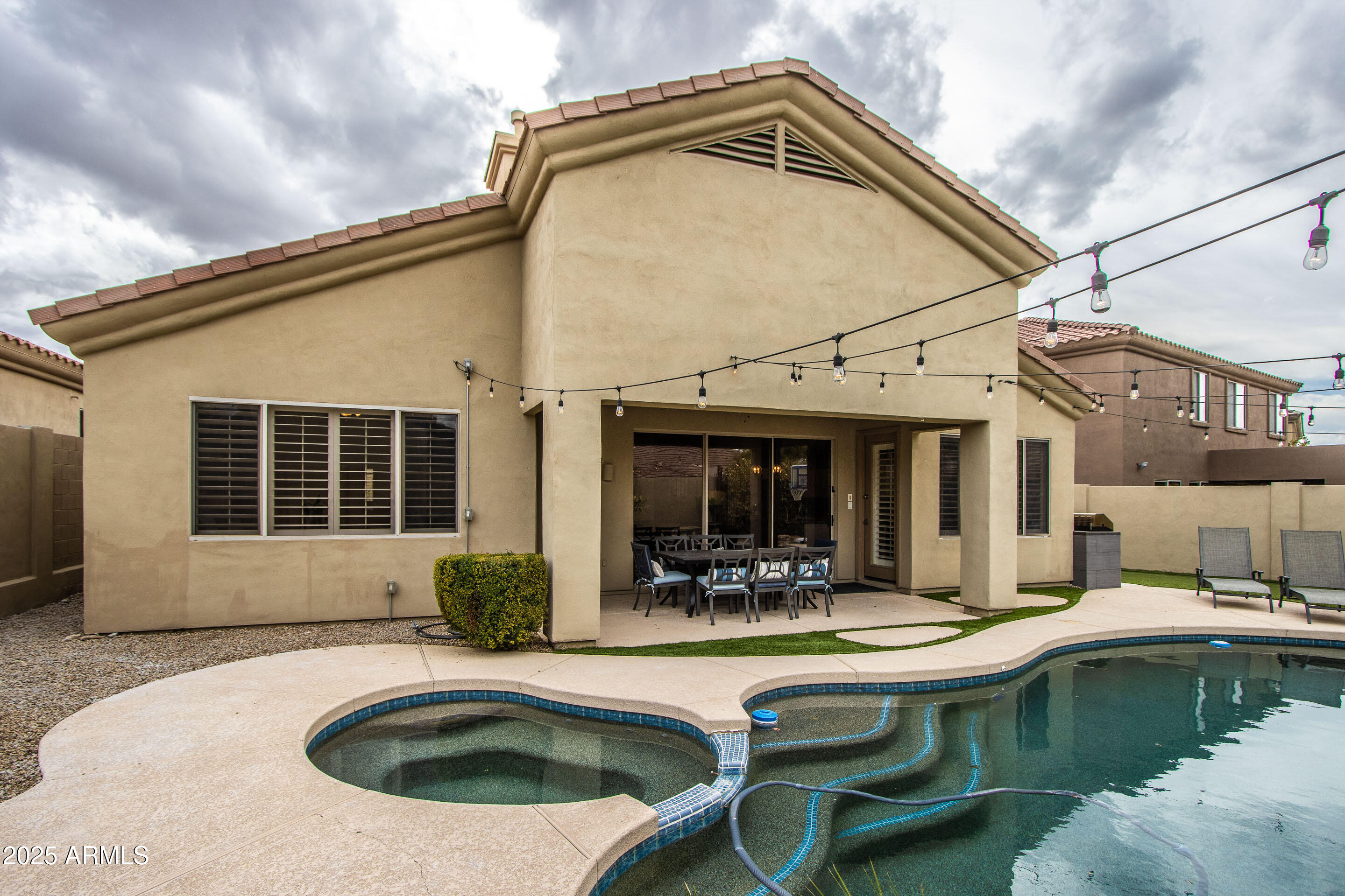 10412 East Acoma Drive Scottsdale, AZ 85255 - Photo 5 of 21 a swimming pool with outdoor seating yard and barbeque oven