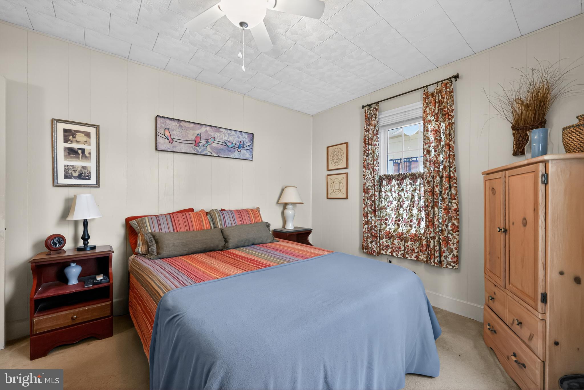 723 Salem Fort Elfsborg Road Salem, NJ 08079 - Photo 27 of 51 a bedroom with a large bed and a chandelier