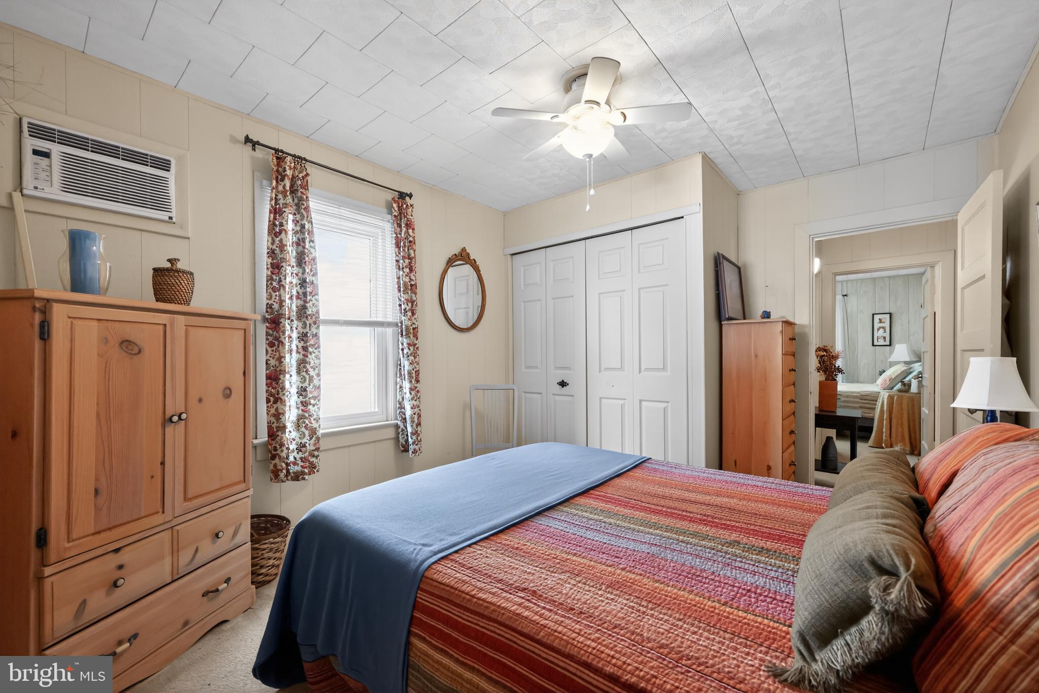 723 Salem Fort Elfsborg Road Salem, NJ 08079 - Photo 28 of 51 a bedroom with a large bed and a chandelier