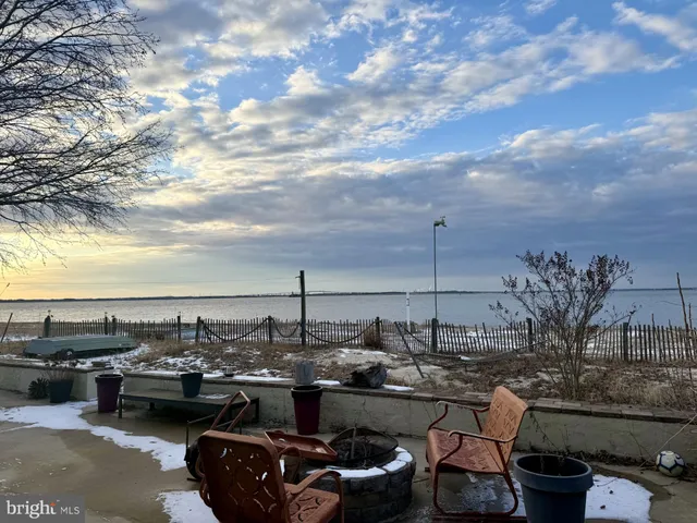 a terrace with outdoor seating and city view