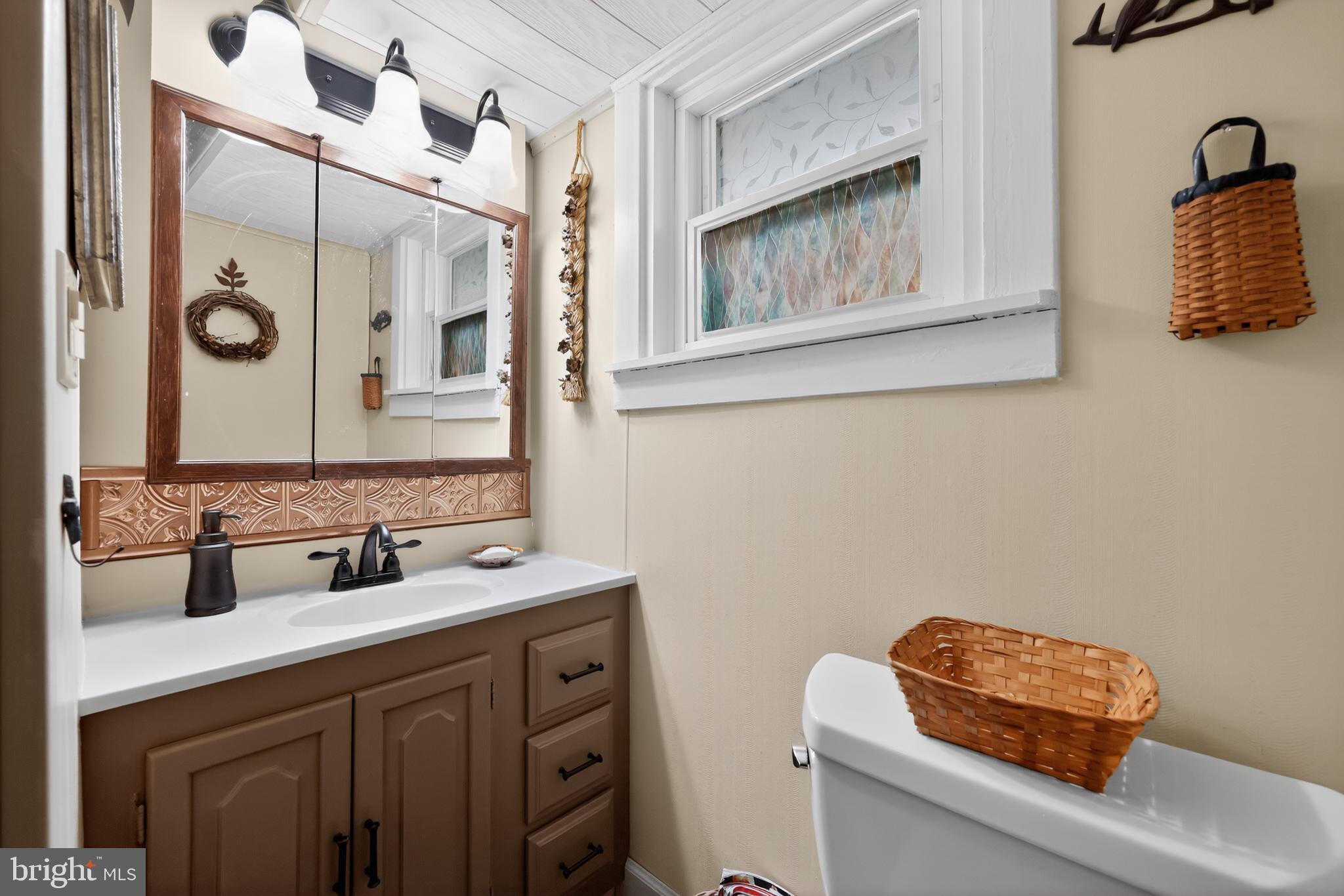 723 Salem Fort Elfsborg Road Salem, NJ 08079 - Photo 31 of 51 a bathroom with a sink and a mirror