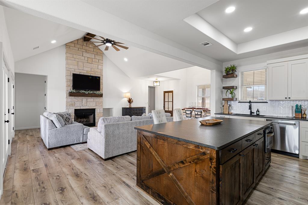 476 Silverleaf Drive Sunset, TX 76270 - Photo 23 of 40 a kitchen with a counter top space a sink cabinets and appliances