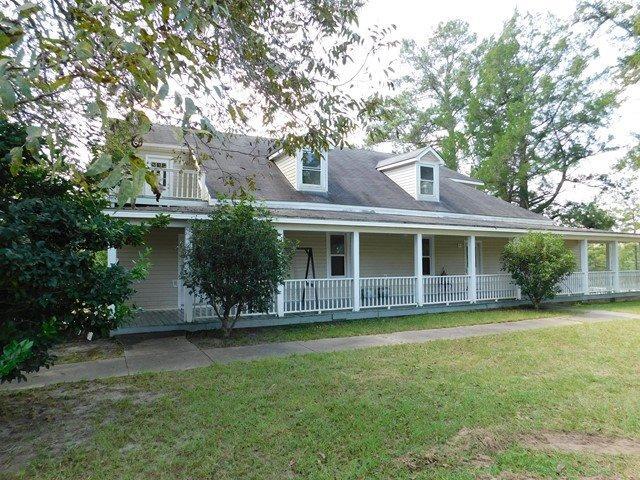 1241 Zenith Mill Road Roberta, GA 31078 - Photo 1 of 31 a front view of house with yard and outdoor seating