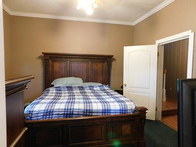 1241 Zenith Mill Road Roberta, GA 31078 - Photo 13 of 31 a bedroom with a bed and dresser