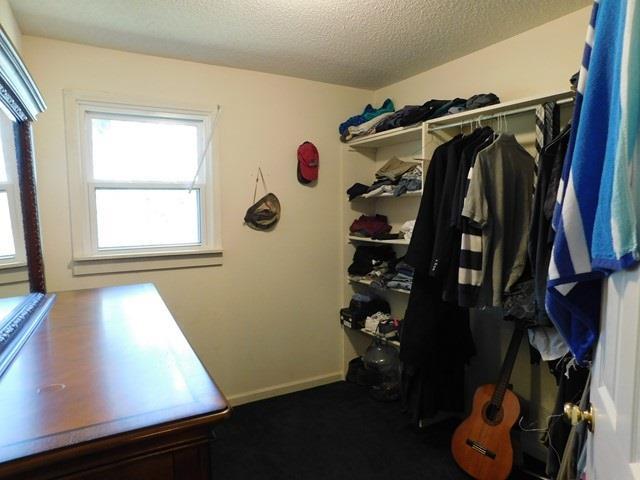 1241 Zenith Mill Road Roberta, GA 31078 - Photo 15 of 31 a view of walk in closet with clothes and shoes