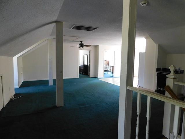 1241 Zenith Mill Road Roberta, GA 31078 - Photo 18 of 31 a view of a hallway with wooden floor and a cabinet