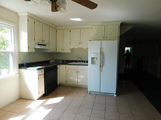 1241 Zenith Mill Road Roberta, GA 31078 - Photo 22 of 31 a kitchen with stainless steel appliances granite countertop a refrigerator and a sink