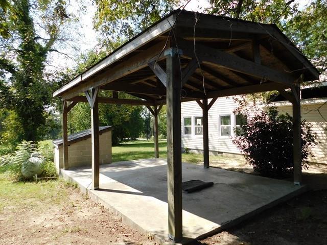 1241 Zenith Mill Road Roberta, GA 31078 - Photo 31 of 31 a view of a barn with a potted plant