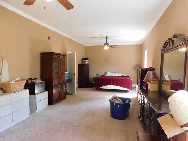 1241 Zenith Mill Road Roberta, GA 31078 - Photo 8 of 31 a living room with furniture a flat screen tv and refrigerator