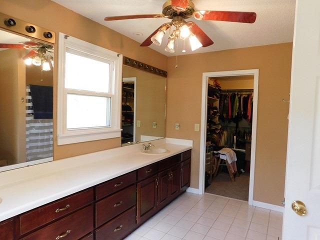 1241 Zenith Mill Road Roberta, GA 31078 - Photo 10 of 31 a spacious bathroom with a sink a large mirror and a shower