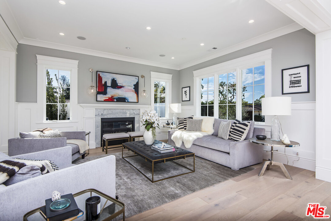 107 Larkin Place Santa Monica, CA 90402 - Photo 11 of 51 a living room with furniture fireplace and a large window
