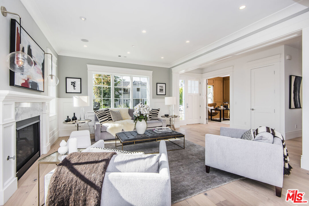 107 Larkin Place Santa Monica, CA 90402 - Photo 14 of 51 a living room with furniture fireplace and window