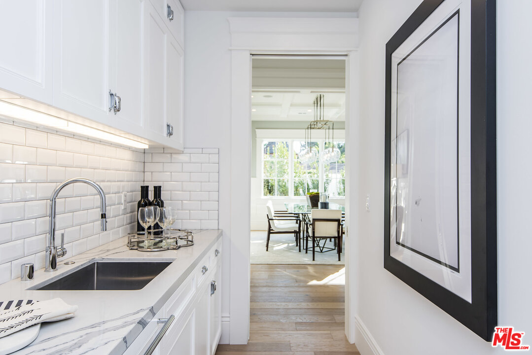 107 Larkin Place Santa Monica, CA 90402 - Photo 19 of 51 a kitchen with a sink and a stove top oven